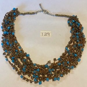 Knotted bronze and turquoise cokes beads.